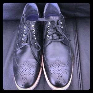 Black Cole Haan wingtip Oxford shoes